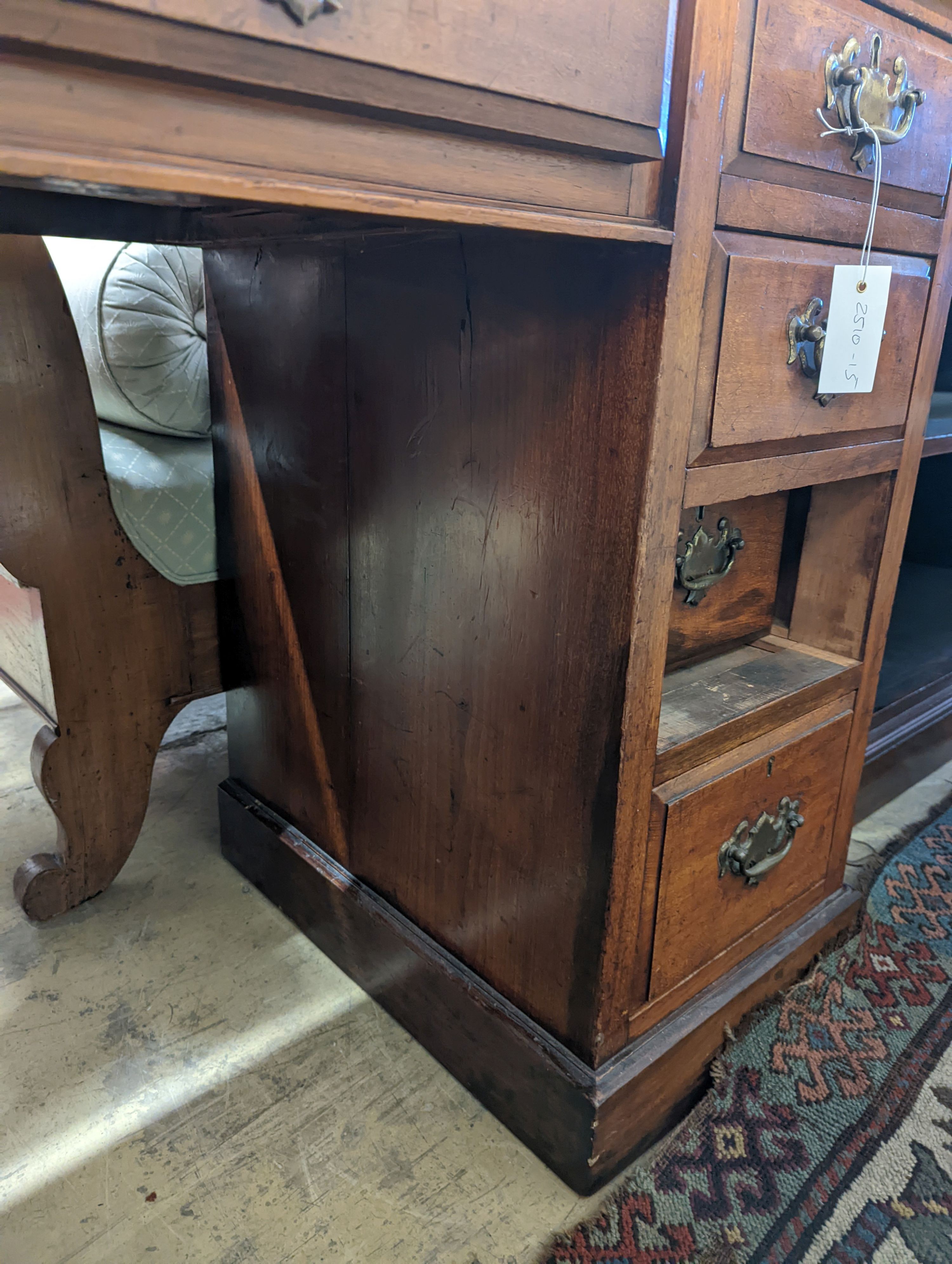 A late Victorian mahogany walnut kneehole desk, length 114cm, depth 55cm, height 78cm